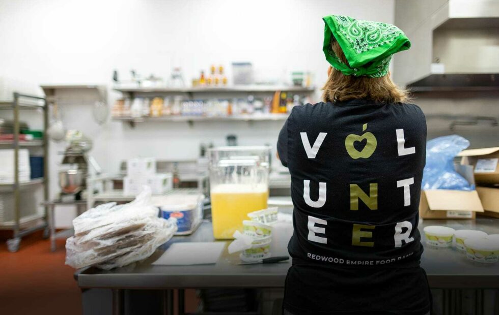 Exchange Bank employee volunteer in the kitchen at Redwood Empire Food Bank, Sonoma County.