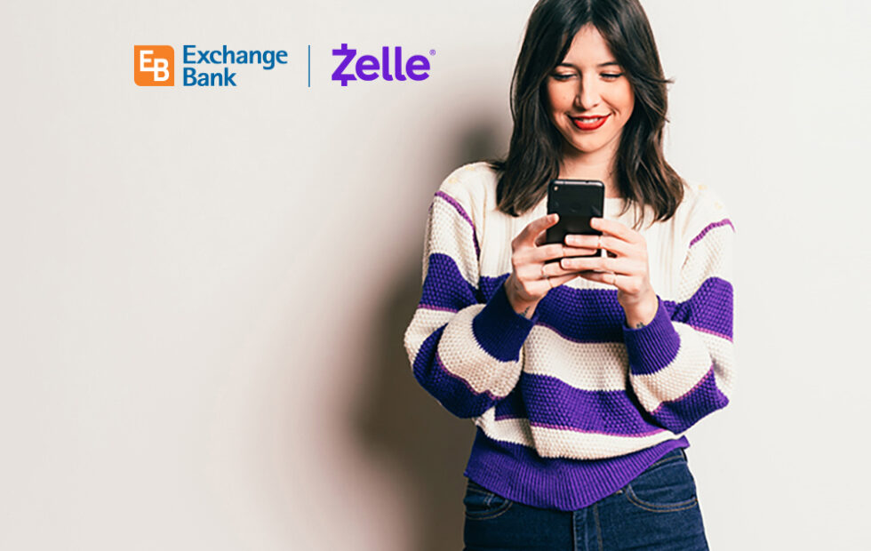 Exchange Bank customer accessing Zelle pay option on her phone.